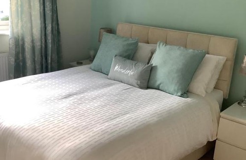 Bournemouth House | Private room, shared bathroom with one other, tea and coffee making facilities, mini fridge and hairdryer, King sized bed with help yourself continental breakfast in Secluded Modern Property with Parking