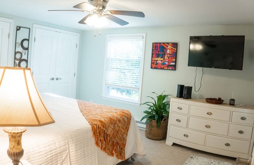 Bloomingburg Cottage | Quaint and Cozy Couples Getaway. Cottage set in a woody area.