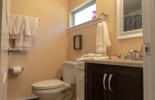 Bloomingburg Cottage | Quaint and Cozy Couples Getaway. Cottage set in a woody area.