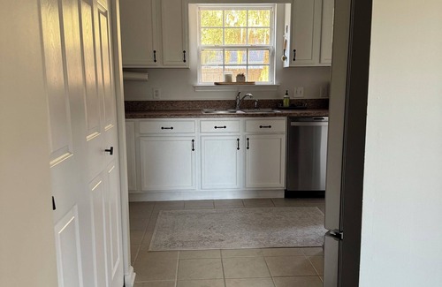 Beaufort House | Quaint Lady’s Island home with a large fenced in yard shaded by a mossy oak!