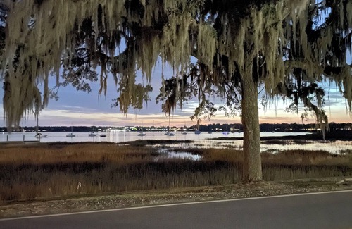 Beaufort House | Quaint Lady’s Island home with a large fenced in yard shaded by a mossy oak!
