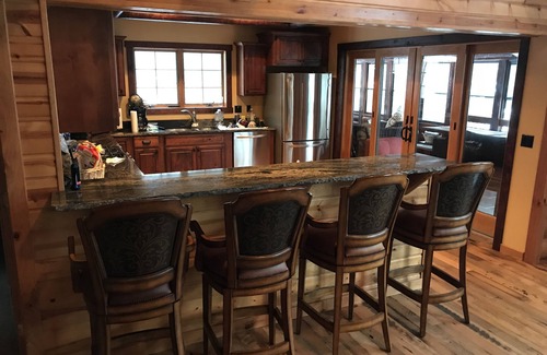 Northville House | RARE 100' OF BEACH LUXURY LOG CABIN ON GSL- GREAT FOR 1 LARGE OR 2 FAMILIES