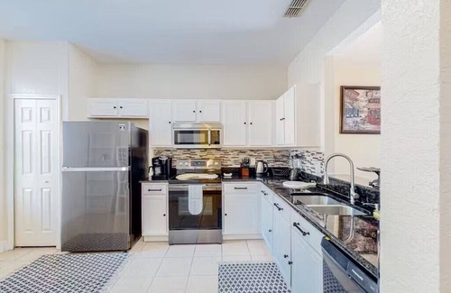 Wellington House | Regal Palms Townhome: Sunshine, Pool, & Golf Fun