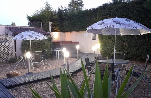 Kneesall Cottage | Relax and unwind at our hot tub retreat, close to activities, trails, water park