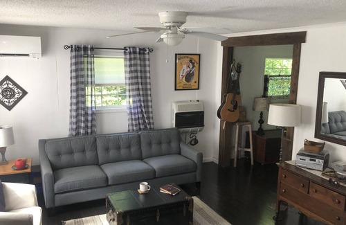 Marshall Cottage | Relax in a hammock chair to the sounds of Mill Creek in Madison County, NC