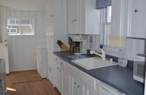 North Beach Haven House | Relax on the deck of this 2nd floor oceanside duplex just steps from the beach.