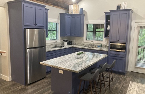 Livingston Cabin | Relax with a view from above in a tree-top getaway! Two Creeks Crossing Resort
