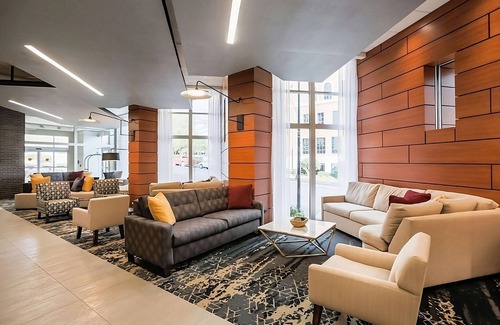 Greenville Downtown Apartment | Relaxing 2 Queen Bed Stay Near Peace Center! Onsite Gym and Pool Access!