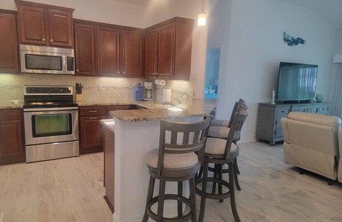 South Gulf Cove House | Relaxing 3 Bedroom - On the canal, private pool, boat dock & access to the gulf.