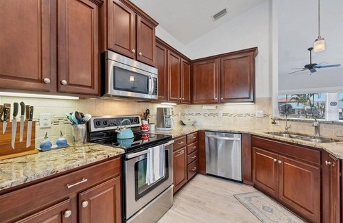 South Gulf Cove House | Relaxing 3 Bedroom - On the canal, private pool, boat dock & access to the gulf.