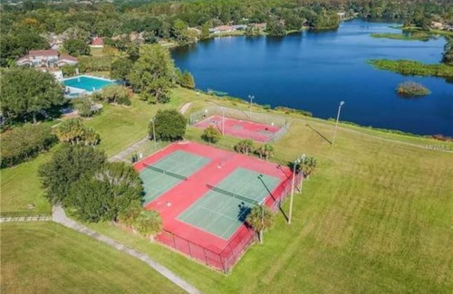 University House | Relaxing townhome with pool and lake