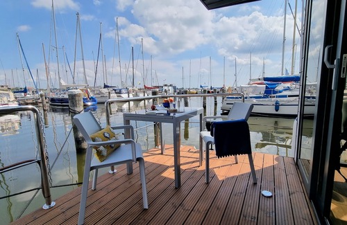 Schleswig Boat Rental | Relaxing vacation on houseboat Hilja with a great view of the Schlei (dog-friendly)
