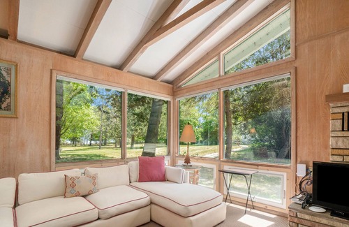 Frankfort Cottage | Remodeled cottage with a modern kitchen, fireplace, kayaks, & paddle boards