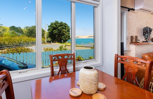 Opononi House | RENOVATED BEACH COTTAGE WITH HARBOUR AND SAND DUNE VIEWS.