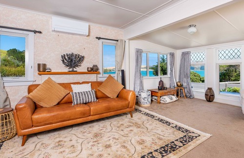 Opononi House | RENOVATED BEACH COTTAGE WITH HARBOUR AND SAND DUNE VIEWS.