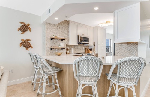 Seawinds Condo Condo | Renovated direct oceanfront corner condo with a large balcony, heated pool, and garage