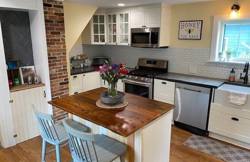 Kennebunk House | Renovated farmhouse featuring two connected rental units with an interior access door. Large Yard