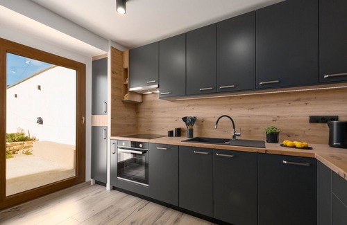 Sajini House | Renovated stone house, two bedrooms with private bathrooms. Big garden, parking.