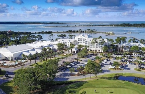 Upper Grand Lagoon Resort | Resort bayside and spa with golfing court.