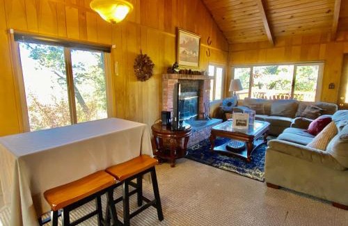 Upper Moonridge House | Rest N Relax Inn - Beautiful chalet-style cabin features dramatic forest and slope views!