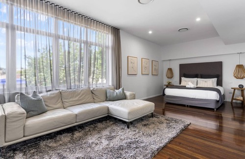 Newcastle West Apartment | Retreat on Denison - Perfect for City Explorers!