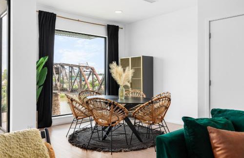 North Capitol House | River View High-End Condo with Private Patio and FREE Parking