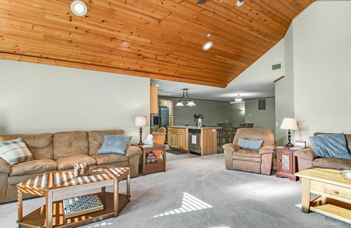 Arkdale Condo | Riverfront golf resort condo with pool, hot tub, volleyball, & fairway-view deck