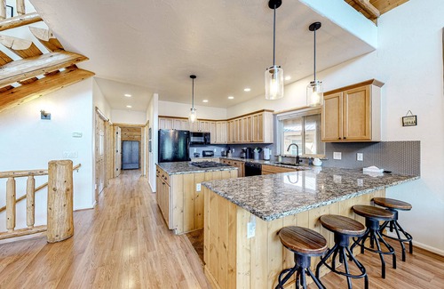 San Juan River Village House | Riverfront home with amazing mountain view, private hot tub, deck & fireplace
