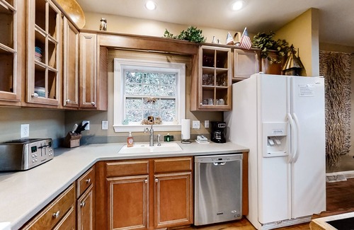 Sylva House | Riverfront home w/fireplace, porch, outdoor firepit, grill and picnic table