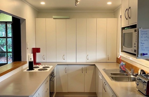 Broadlands Forest House | Riverside accommodation which is perfect for groups. Pizza oven, covered deck.
