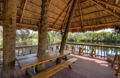 Braden River Apartment | Riverside Breeze Tropical Retreat w Tiki Hut&BBQ