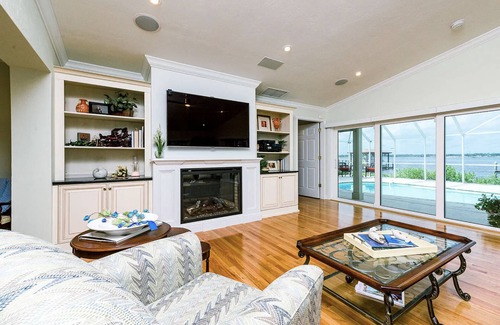 Van Valzah House | Riverside Retreat- 3/3 with pool, dock, grill 2 block walk to the beach!