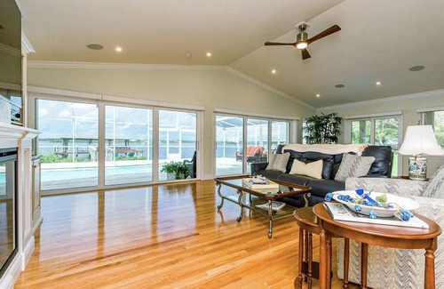 Van Valzah House | Riverside Retreat- 3/3 with pool, dock, grill 2 block walk to the beach!