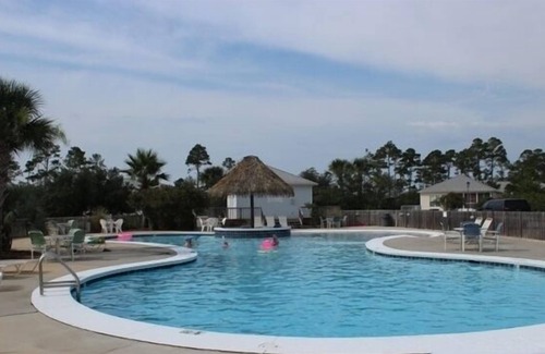 Fort Morgan Cottage | Rookery 3402 Cottage Minutes Away from Beach and the Gulf by RedAwning