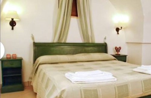 Ostuni Bed & Breakfast | "room in B&B - Spacious Quadruple Room in Ancient Masseria Near the sea in a Quiet Olive Trees."
