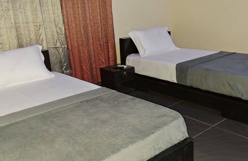 Lome House | Room in Guest Room - Deluxe Twin Beds in Royal Blue Guest House and Bar