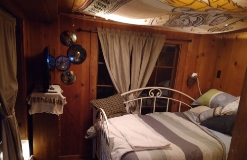 Redwood City Cabin | Rooms/tents in quaint original log cabin nestled in the Redwood trees on creek.
