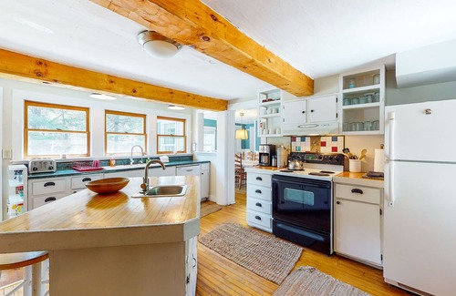 Plymouth House | Roomy farmhouse with private hot tub, firepit, pool table, sunroom, & woodstove