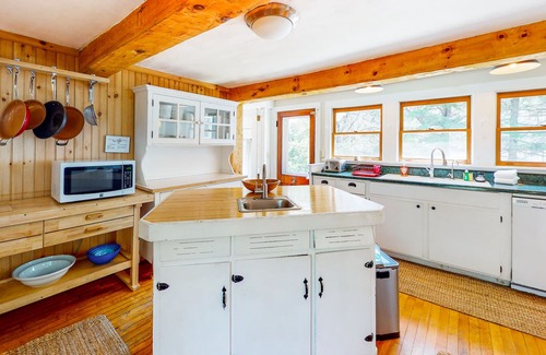 Plymouth House | Roomy farmhouse with private hot tub, firepit, pool table, sunroom, & woodstove