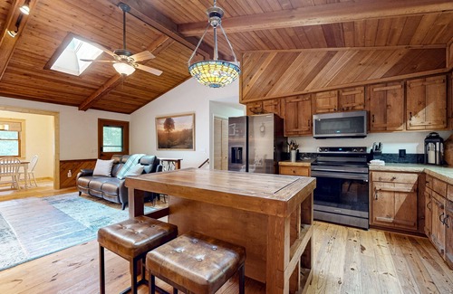 Blairsville Cabin | Rural cabin in wooded lot with firepit, fireplace, grill, wraparound deck, W/D