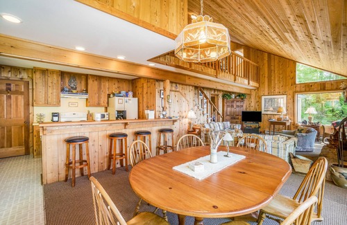 Lake Township House | Rustic dream-home w/lake views, wraparound deck, & wood-burning fireplace