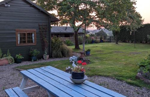 Harmer Hill House | Rustic Log Cabin - Dog Friendly - Sleeps 2 - Views
