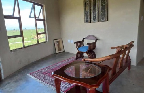 Lusikisiki Cottage | Rustic Retreat In A Peaceful Village. Overlooking The River And Ocean.
