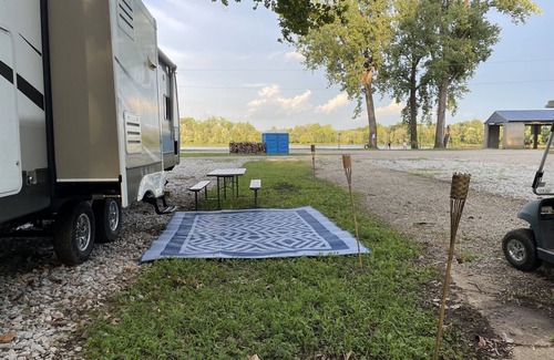 Saint Mary Of The Woods RV Rental | RV on a lake in a campground. Great for parties