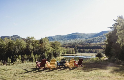 North Woodstock RV Rental | Safari Tent Site 10 | 1 Queen Bed & 1 Bunk Bed | Woods View