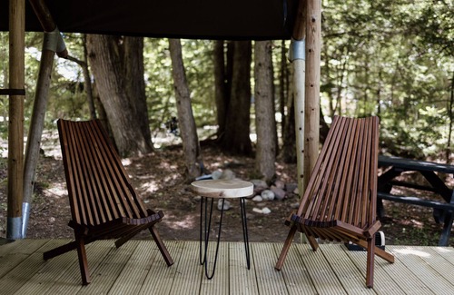 Woodstock RV Rental | Safari Tent Site 4 | 1 King Bed | Pond View