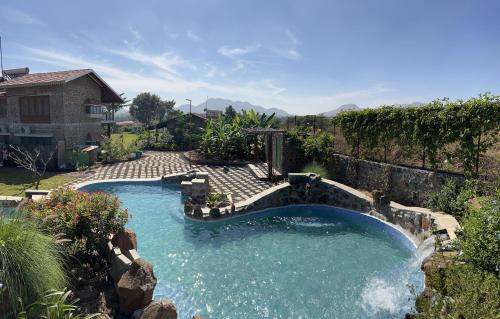 Mahiravani Villa | SaffronStays Lake House Bouganvillea, Nashik - rustic pool villa with great lake views and patio dining