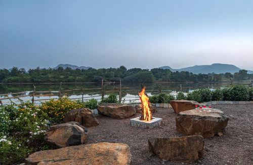 Mahiravani Villa | SaffronStays Lake House Bouganvillea, Nashik - rustic pool villa with great lake views and patio dining