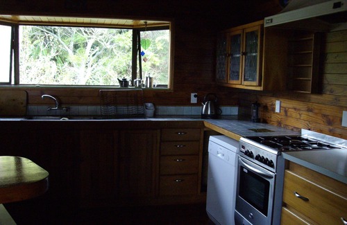 Matapouri House | Sandy Bay overlooking Poor Night Islands you will find Valley of Dreams