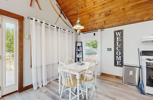 Greenville House | Scenic retreat with a spacious deck, gas fireplace, and Moosehead Lake views